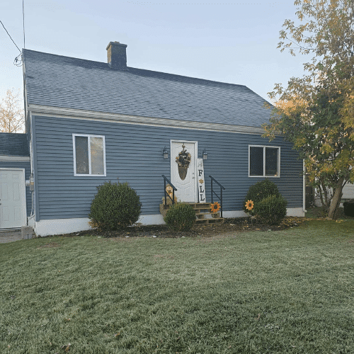 Central New York home exterior remodel by Homes by Covenant featuring new siding and roofing