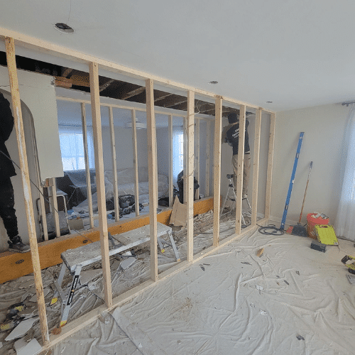 Interior wall framing and remodeling project in progress by Homes by Covenant construction team