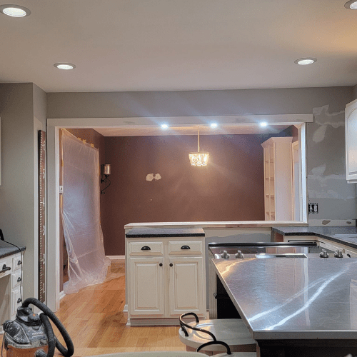 Kitchen remodel mid-phase featuring open layout and new lighting installed by Homes by Covenant