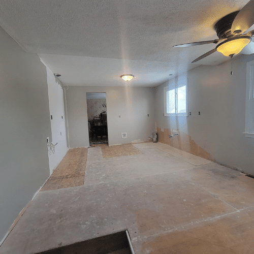 Completed bedroom remodel featuring new lighting, paint, and trim by Homes by Covenant in Central New York
