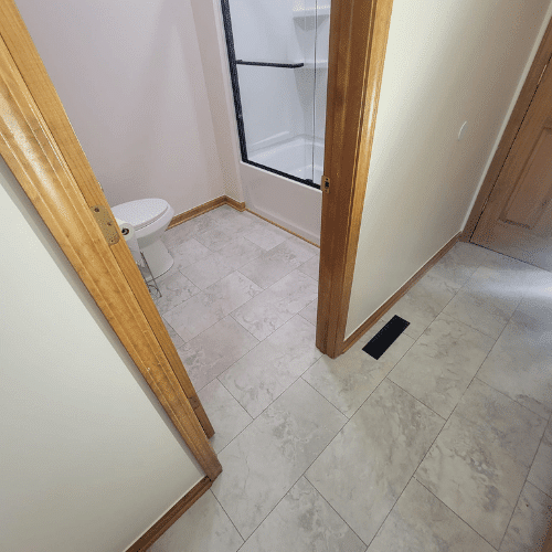 Bathroom flooring upgrade and tile installation project completed by Homes by Covenant renovation team