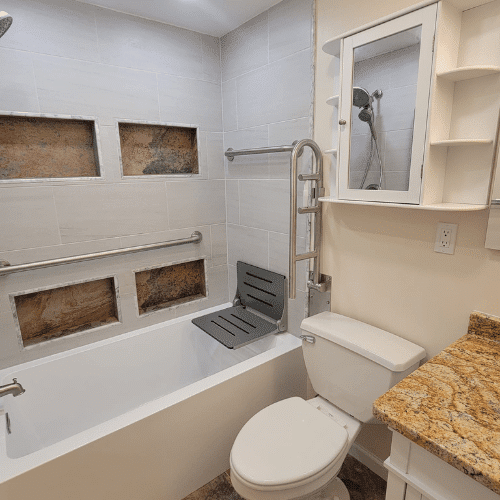 Bathroom remodel completed with updated shower, countertop, and cabinet installation by Homes by Covenant