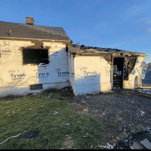 Fire restoration project underway with structural rebuild and debris removal by Homes by Covenant