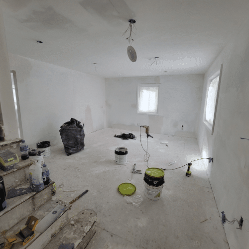 Homes by Covenant renovation team restoring interior walls and ceilings during home remodeling project