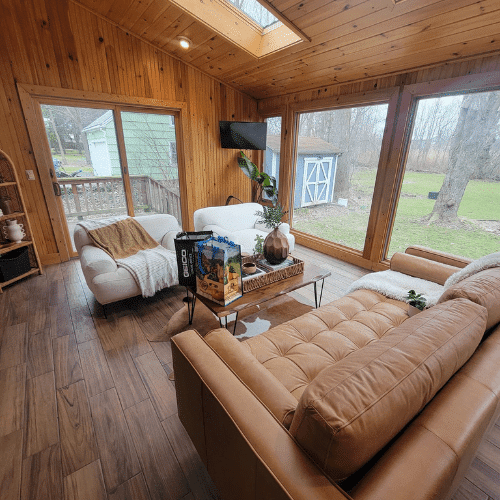 Living room renovation project before furnishing, showing newly installed floors and window frames by Homes by Covenant