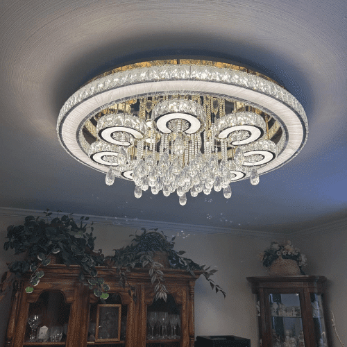 Modern chandelier light fixture installed as part of bathroom and interior renovation by Homes by Covenant