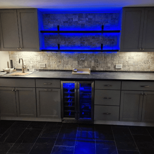 Modern kitchen renovation with lighting and cabinetry design completed by Homes by Covenant