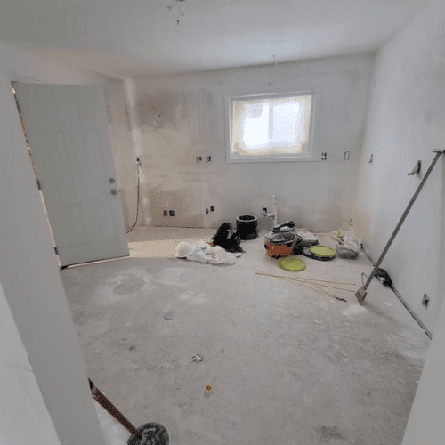 Home interior under construction showing drywall and layout framing by Homes by Covenant