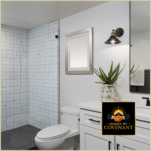 Bright modern bathroom renovation with new vanity, tilework, and updated fixtures.