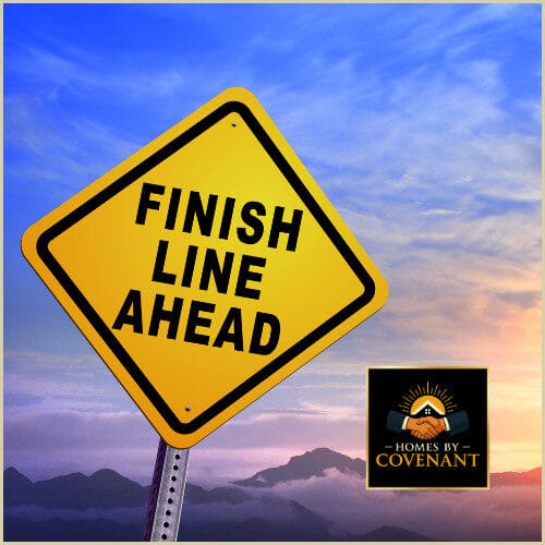 “Finish line sign symbolizing the final button-up and completion phase of modular home construction.”