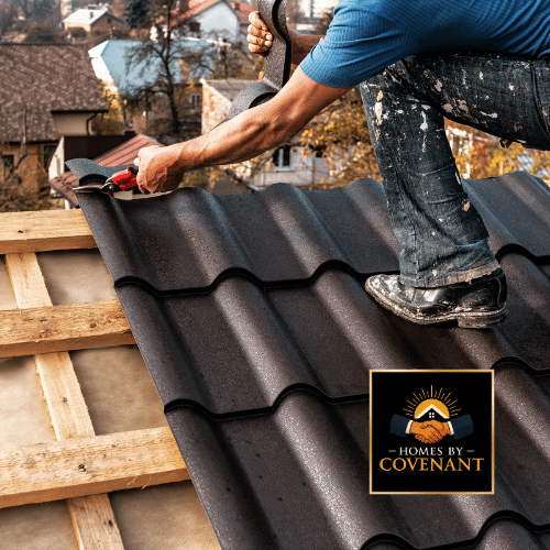 Contractors installing new shingles on a shed roof.