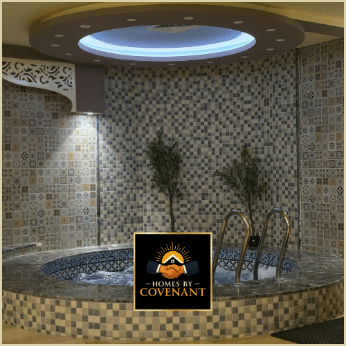 Custom tile shower with mosaic walls and integrated ceiling lighting.