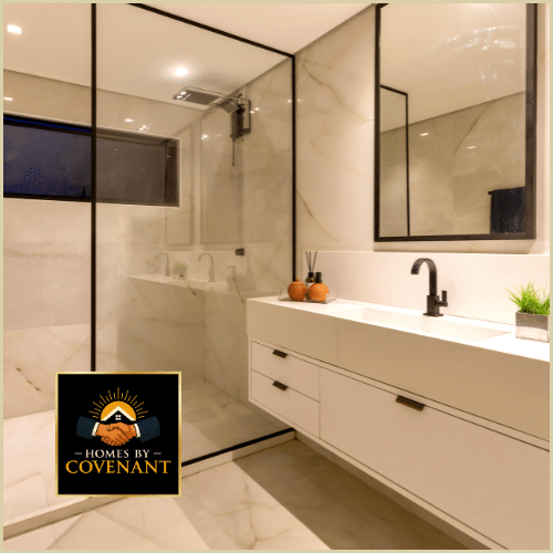 Modern bathroom with a double-sink vanity, warm lighting, and elegant stone countertops.
