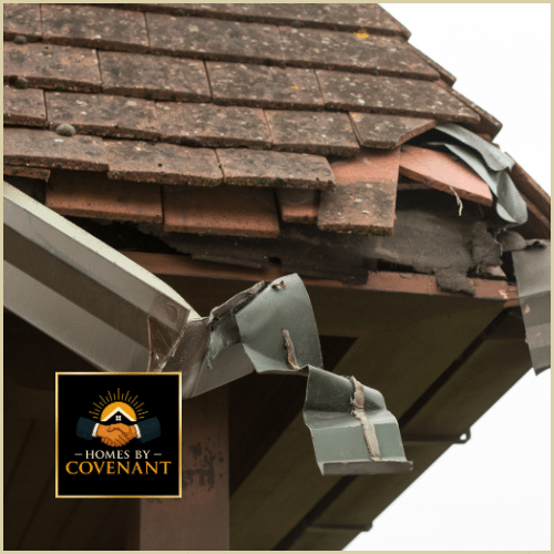 Damaged gutter and roofline showing bent metal and structural deterioration.