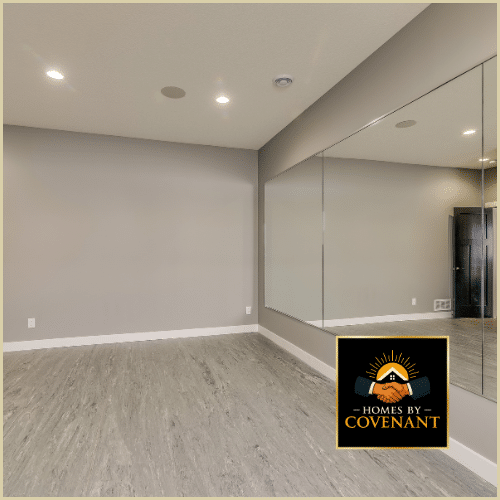 Large finished basement with modern flooring, recessed lighting, and open recreation space.