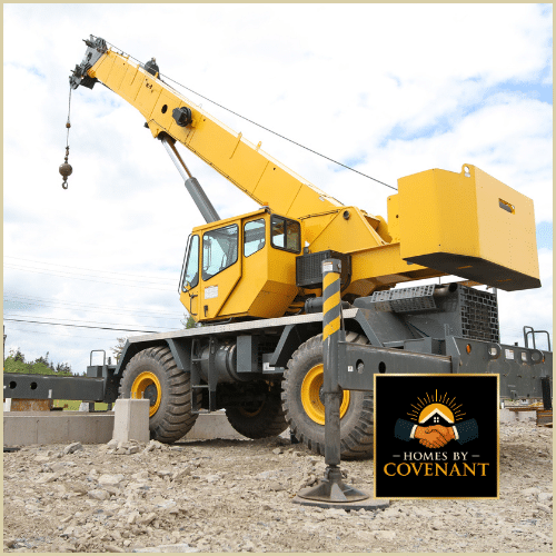 “Crane preparing to lift modular home modules into place during crane day setup.”