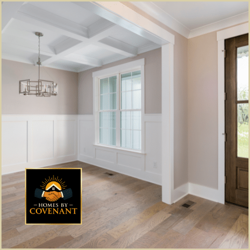 Interior room with updated trim, baseboards, and fresh flooring installation.