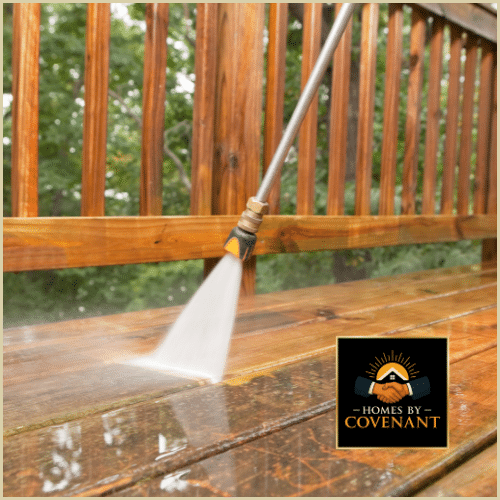 Power washing deck boards to prepare for staining or painting.