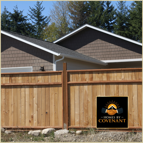 Vertical wood privacy fence panels installed for full backyard coverage.