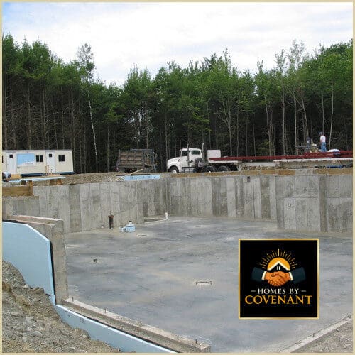 Excavated basement foundation site prepared for modular home installation.