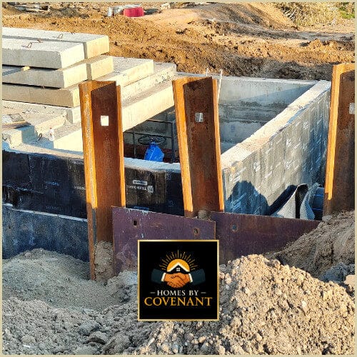 Foundation drainage system with waterproofing membrane and gravel bed.